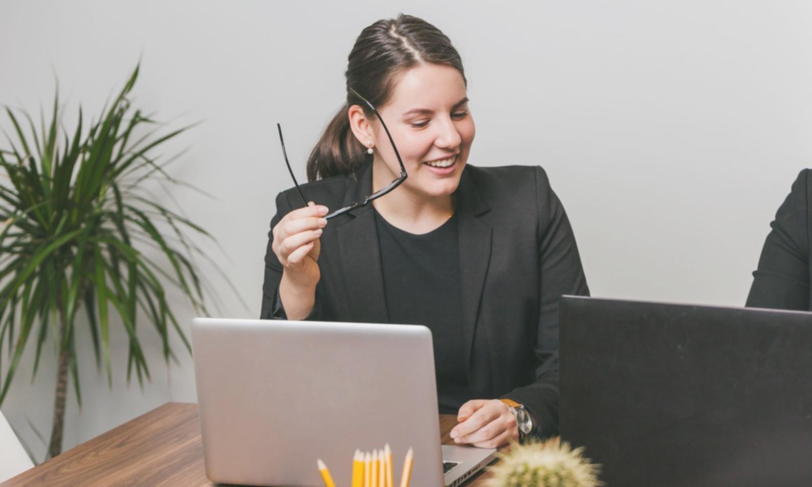Financial analyst reviewing budget compliance reports and variance analysis charts